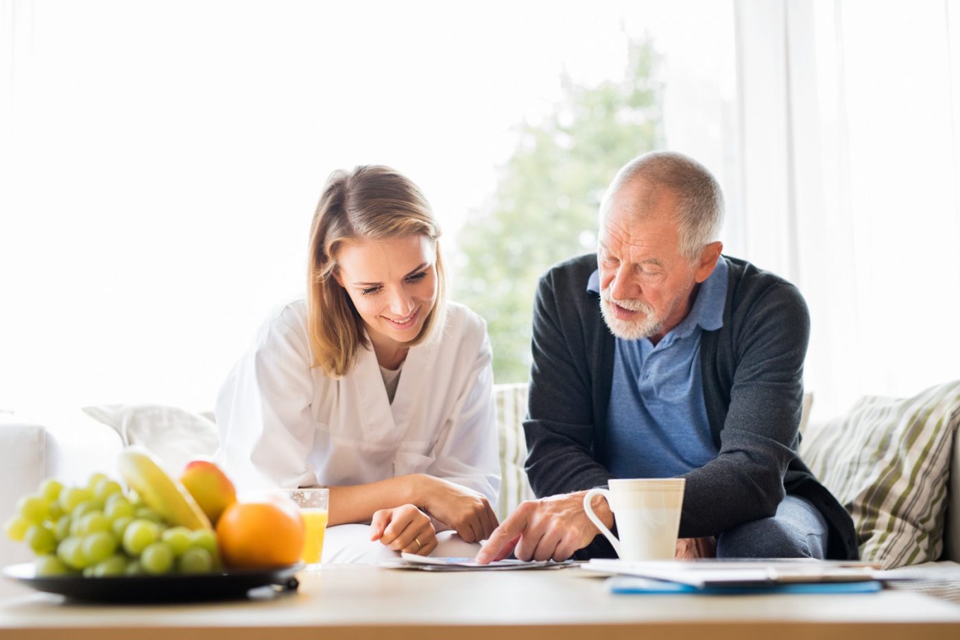 health-visitor-and-a-senior-man-with-tablet-p2qtnng health-visitor-and-a-senior-man-with-tablet-p2qtnng