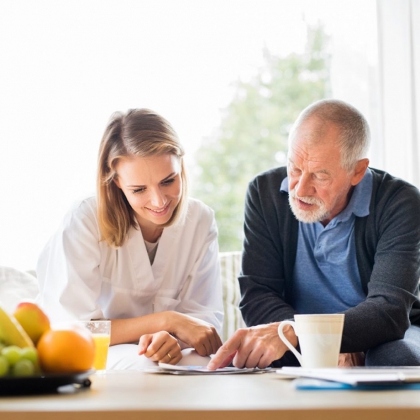 health-visitor-and-a-senior-man-with-tablet-p2qtnng health-visitor-and-a-senior-man-with-tablet-p2qtnng